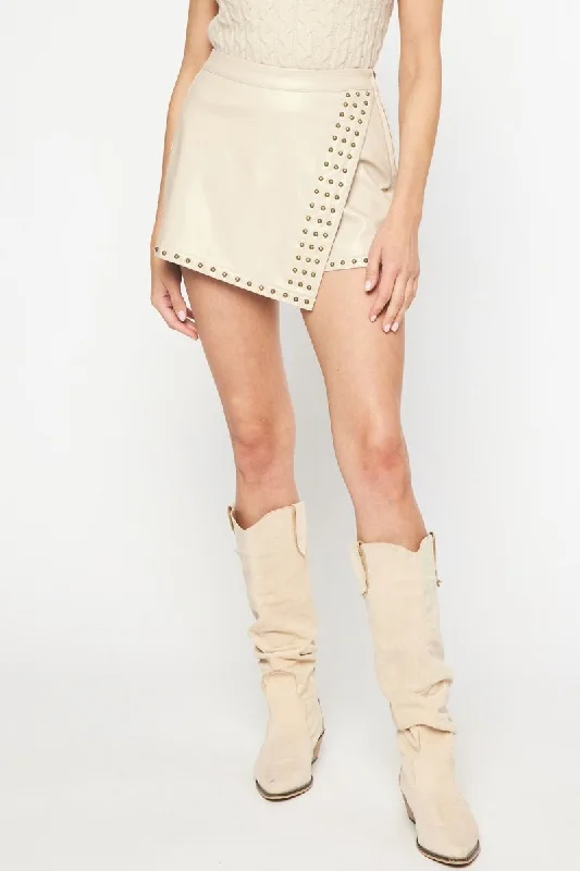 Trendy Athleisure Clothing For Women Bold Silhouette Studded Faux Leather Ecru Skort Trendy Athleisure Clothing For Women Bold Silhouette Studded Faux Leather Ecru Skort